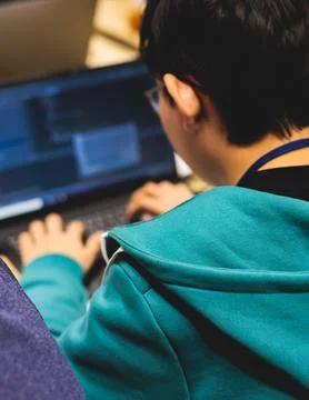 Software developer students in auditorium hall working on computer and lapt.. Stockfoto's