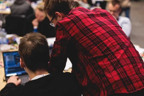 Software developer students in auditorium hall working on computer and lapt.. 스톡 사진