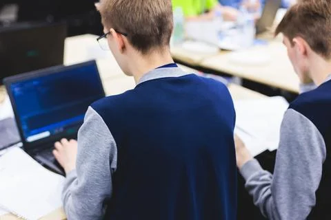 Software developer students in auditorium hall working on computer and lapt.. 스톡 사진