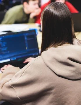 Software developer students in auditorium hall working on computer and lapt.. Foto stock