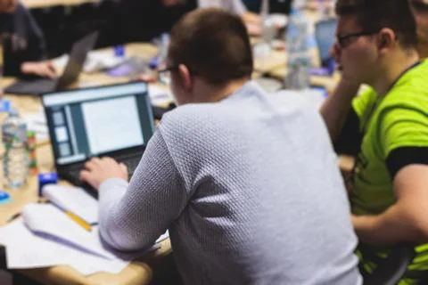 Software developer students in auditorium hall working on computer and lapt.. Foto stock