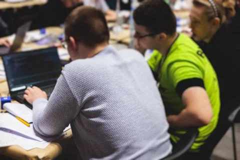 Software developer students in auditorium hall working on computer and lapt.. Foto stock