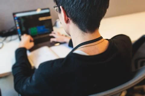 Software developer students in auditorium hall working on computer and lapt.. Stock Photos