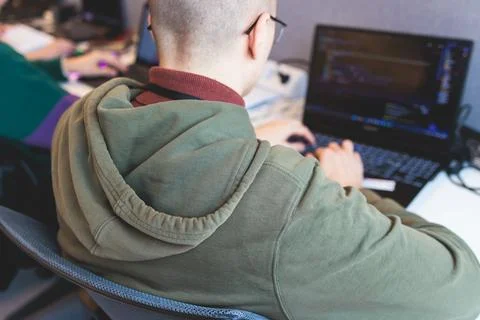 Software developer students in auditorium hall working on computer and lapt.. 스톡 사진