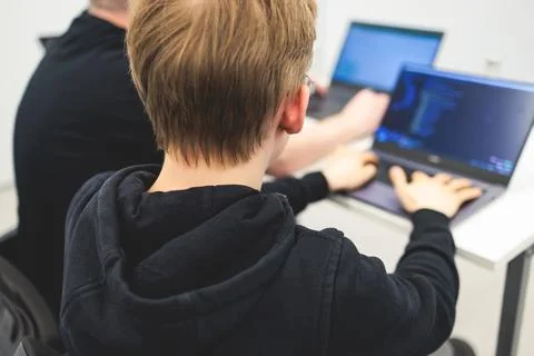 Software developer students in auditorium hall working on computer and lapt.. 스톡 사진