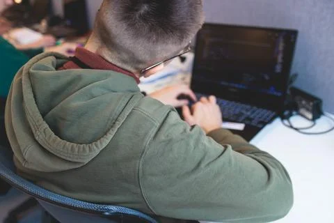 Software developer students in auditorium hall working on computer and lapt.. 스톡 사진