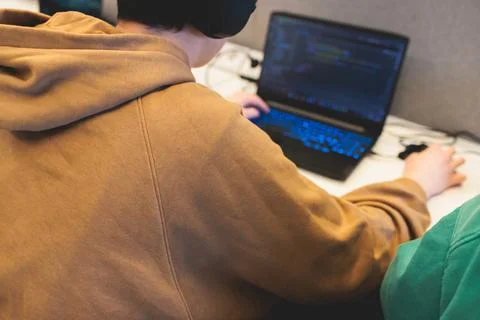 Software developer students in auditorium hall working on computer and lapt.. Stock Photos