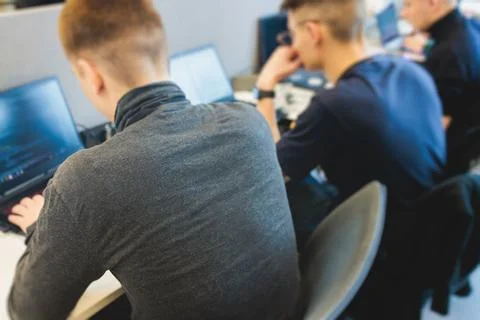 Software developer students in auditorium hall working on computer and lapt.. 스톡 사진