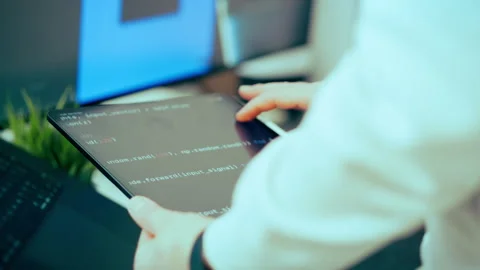 Software developer tablet code analysis office workspace Stock Footage 329663033