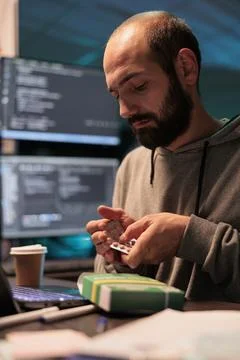 Software developer taking medicine pills from box Foto stock