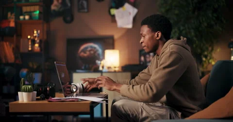 Software Developer talented African American man working remotely as a software Stock Footage 245403462