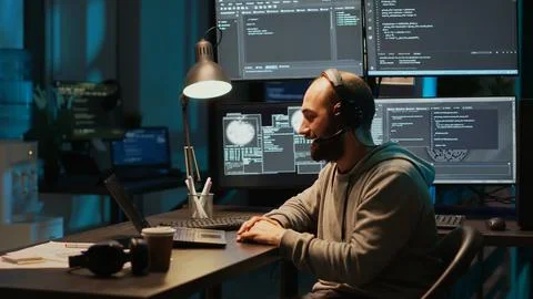 Software developer talking to people on remote videoconference Stock Photos