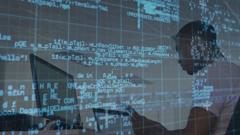 Software developer tapping tablet and typing at desk for review, causing code Stock Footage 331227573