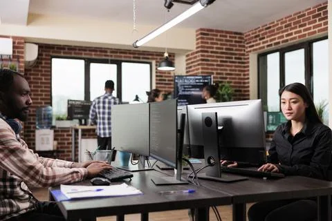 Software developer team programming encryption applications to be used as Stock Photos