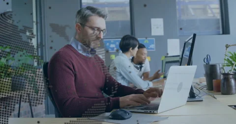 Software developer typing code and starting map overlay in office as team Stock Footage 311085357