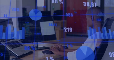 Software developer typing on keyboard at desk with floating data charts Stock Footage 307435159