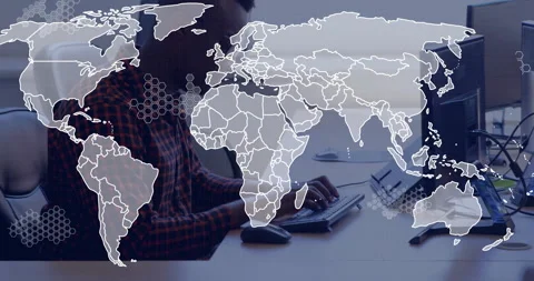 Software developer typing at keyboard in modern office, overlaying global map Stock Footage 307435246