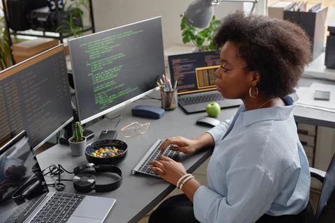 Software Developer Typing on Keyboard in Office Stock Photos