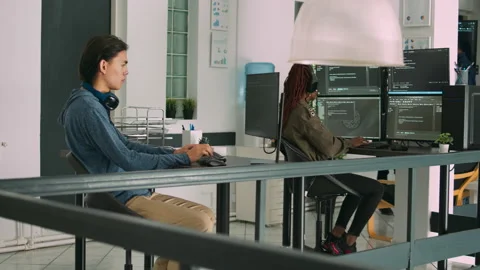 Software developer typing programming code on computer keyboard Stock Footage 221744405