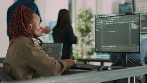 Software developer typing programming code on computer Stock Footage 227618305