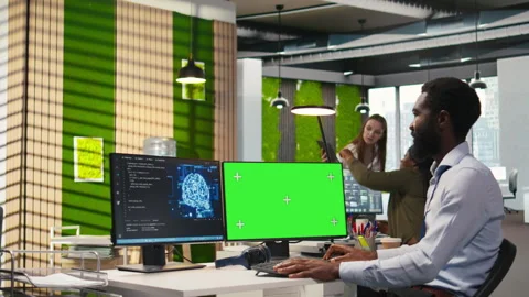 Software developer using AI on green screen computer to optimize performance Stock Footage 313166826