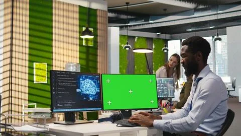 Software developer using AI on green screen computer to optimize performance Stockfoto's