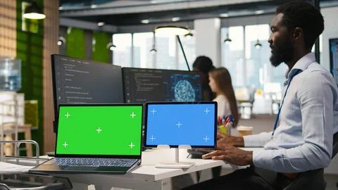 Software developer using AI on isolated screen laptop and tablet Stock Photos