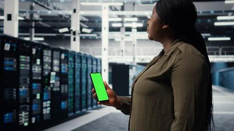 Software developer using app on mockup phone to do server hub checkup Stock Photos