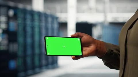 Software developer using app on mockup phone to do server hub checkup Stock Photos