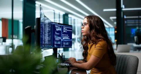Software Developer Using Computer To Write Clean Code Efficiently. Stock Photos