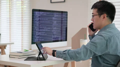 Software developer using generative AI automation code assistant help working Stock Footage 255692292