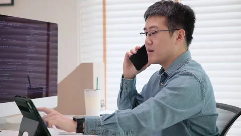 Software developer using generative AI automation code assistant help working Stock Footage 255692298