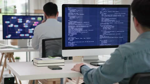 Software developer using generative AI automation code assistant help working Stock Footage 255720610