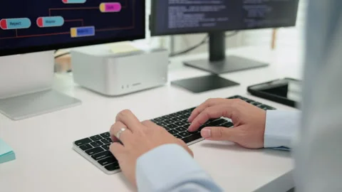 Software developer using generative AI automation code assistant help working Stock Footage 255720648