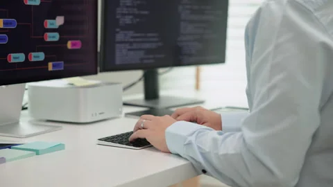 Software developer using generative AI automation code assistant help working Stock Footage 258717004