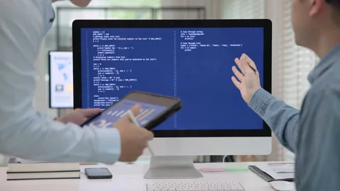 Software developer using generative AI automation code assistant help working Stock Footage 260433467