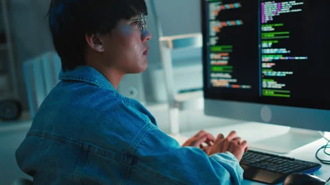 Software developer using keyboard debugging code task programming system dual Stock Footage 313813612
