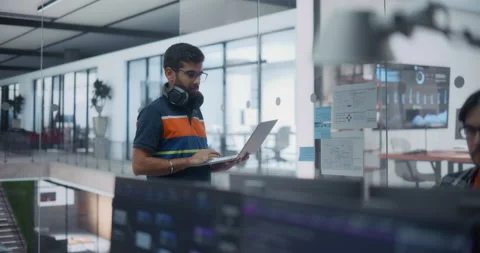 Software Developer Using Laptop Computer in Office Stock Footage 296184954