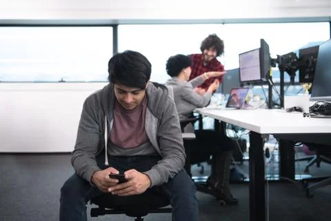 Software developer using mobile phone Stock Photos