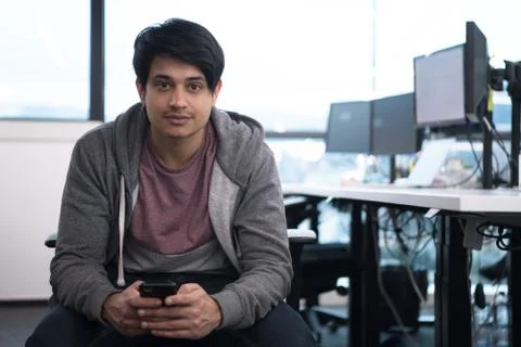 Software developer using mobile phone Stock Photos