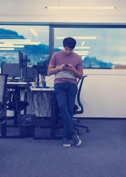 Software developer using mobile phone Stock Photos