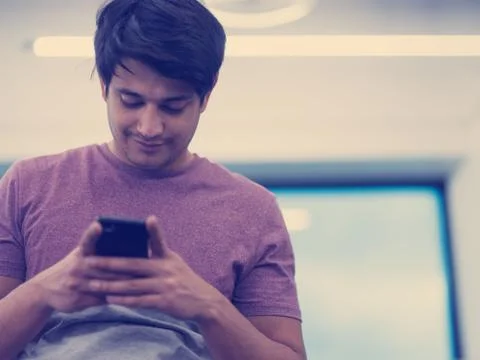 Software developer using mobile phone Stock Photos