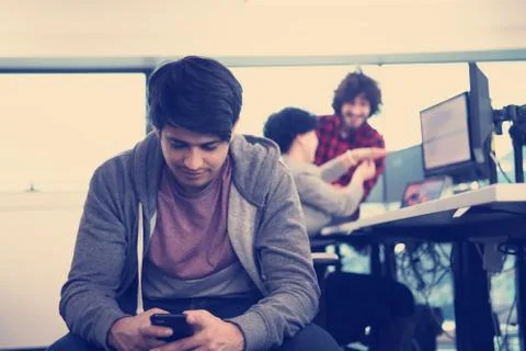 Software developer using mobile phone Stock Photos