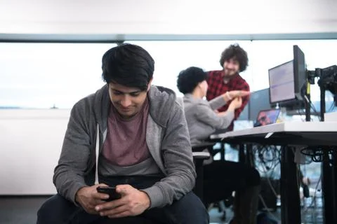 Software developer using mobile phone Stock Photos