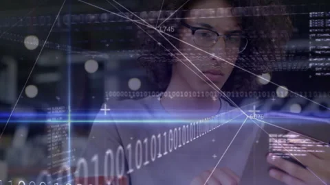 Software developer using smartphone with binary digits data grid lines and light Stock Footage 309255216