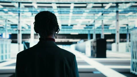 Software developer walks in data center, using tablet and AR technology 스톡 동영상 329945452