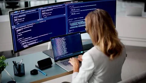Software Developer Woman Happily Writes And Tests Code Using Online Cloud IDE Fotos Stock