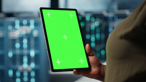 Software developer at work using green screen tablet in data center Stock Footage 317203226