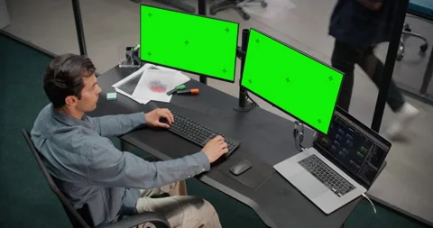 Software Developer Working on Computer with Green Screen Stock Footage 321012406