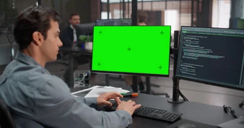 Software Developer Working on Computer with Green Screen Stock Footage 321012494